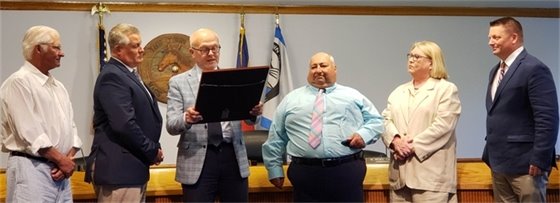 At their July 7, 2021 meeting, Nags Head’s Board of Commissioners recognized former public works director Ralph Barile for 38 years of service to the town. In addition, the Board presented Ralph with the prestigious Order of the Long Leaf Pine, the highest award granted by the State of North Carolina to individuals who have shown extraordinary service to our state. Ralph began his career in 1982 as a street laborer and rose through the ranks to lead the Town’s public works department. From left are Nags Head Commissioners Webb Fuller and Kevin Brinkley, Mayor Ben Cahoon, Ralph Barile, Commissioner Renée Cahoon, and Mayor Pro Tem Mike Siers. 