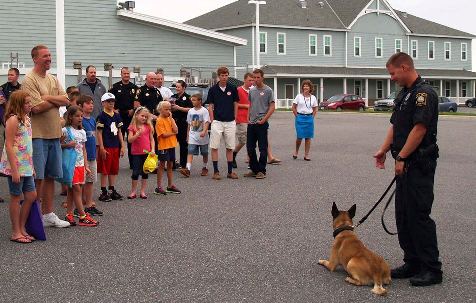 Officer and dog presenting to group